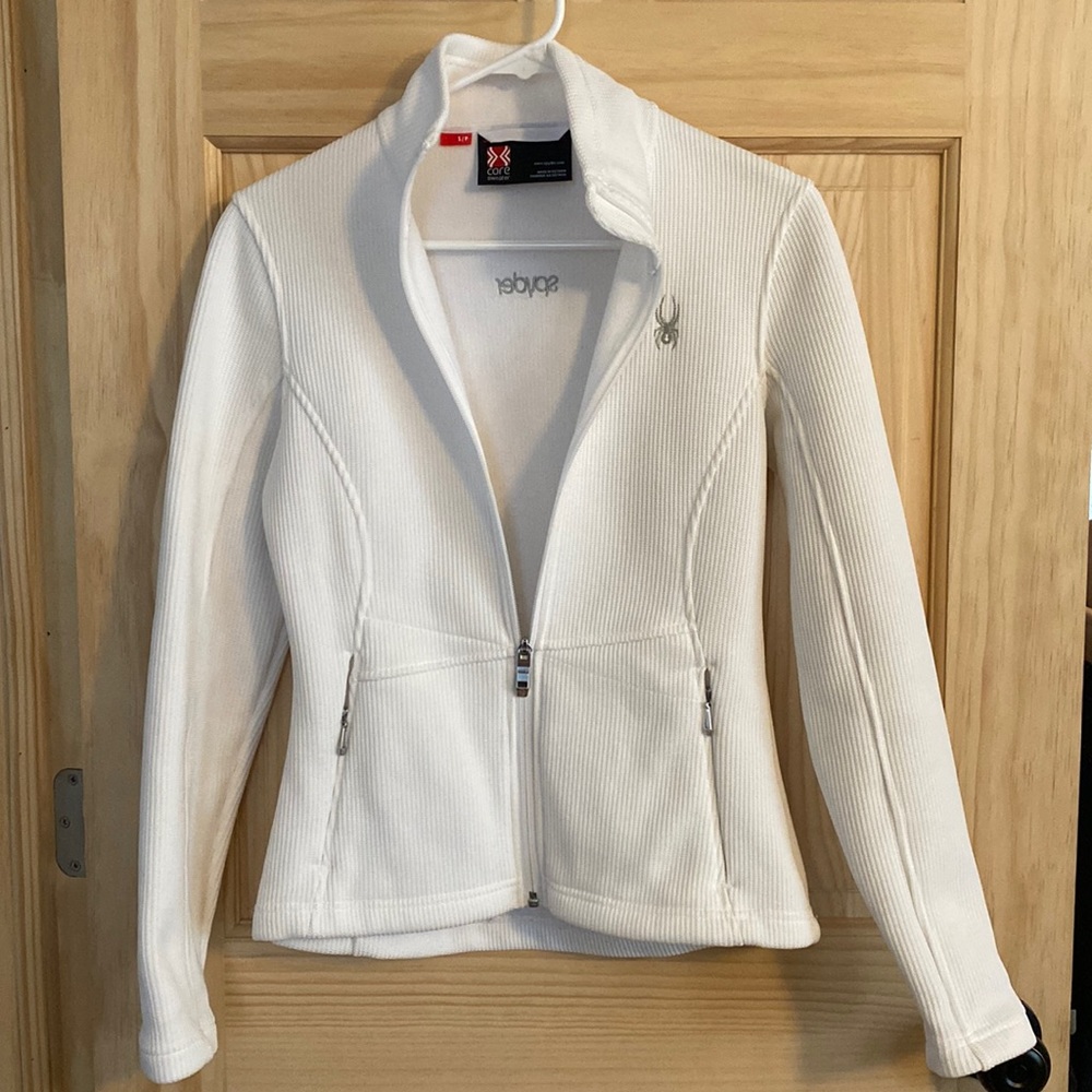 Spyder core sweater small bright white no flaws or discoloration.  Barely worn